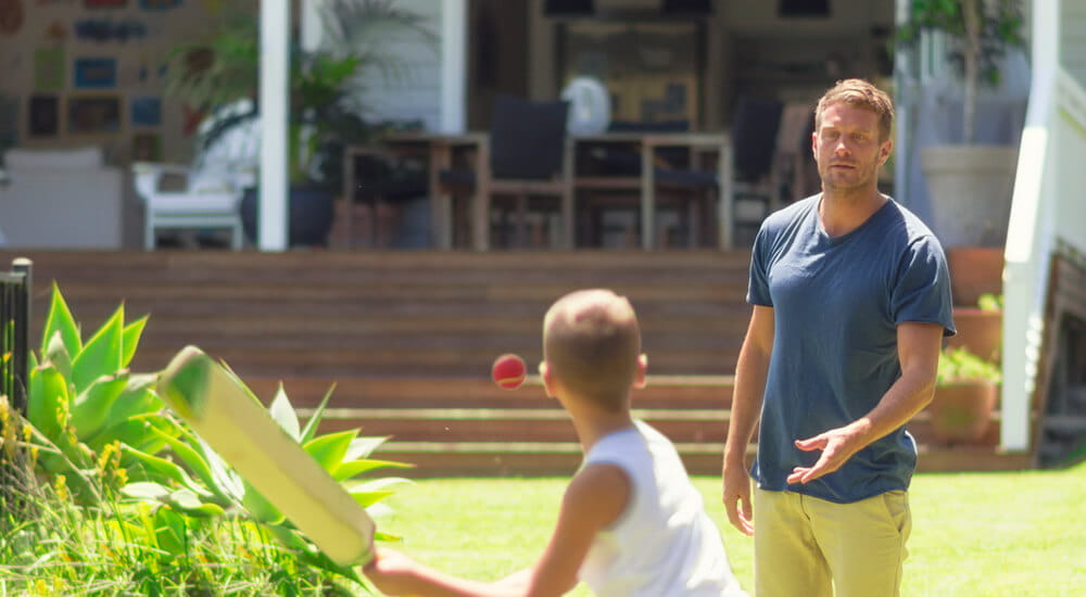 Australian Housing Outlook 2021 – 2024 - father and son playing cricket in the backyard